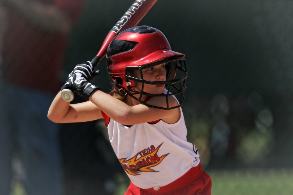 boy plays baseball