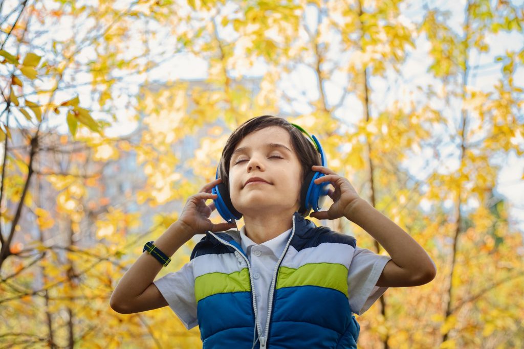 little boy listening the music 